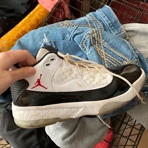 They are in good condition. They are black and white and the Jordan sign is red